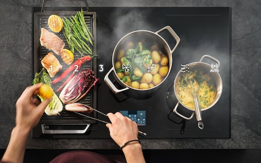 Food cooking on a hob.